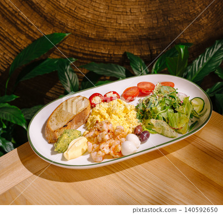 Healthy gourmet breakfast plate with scrambled eggs and shrimp Healthy gourmet breakfast plate with scrambled eggs and shrimp 140592650