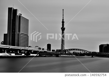 A monochrome view of Tokyo Skytree and the newly renovated Shirahige Bridge from the Sumida River Terrace. A monochrome view of Tokyo Skytree and the newly renovated Shirahige Bridge from the Sumida River Terrace. 140592754