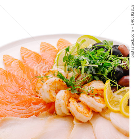 Seafood platter with salmon, shrimp, white fish, olives and lemons Seafood platter with salmon, shrimp, white fish, olives and lemons 140592818