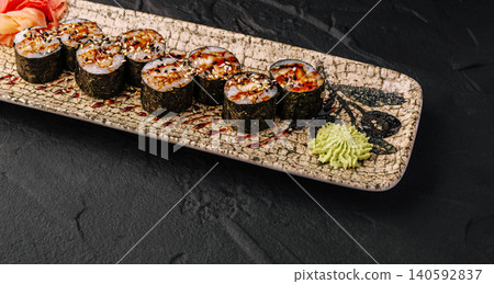 Unagi maki sushi rolls with wasabi and ginger Unagi maki sushi rolls with wasabi and ginger 140592837