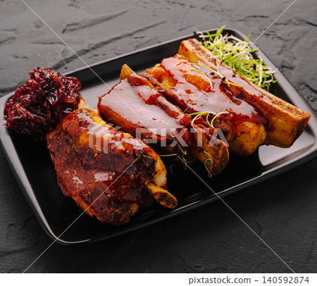 Glazed barbecue beef short ribs with garnish Glazed barbecue beef short ribs with garnish 140592874