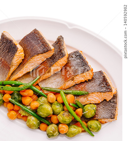 Salmon fillets served with steamed vegetables healthy meal 140592982