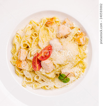 Creamy salmon fettuccine pasta with parmesan and tomato 140593002