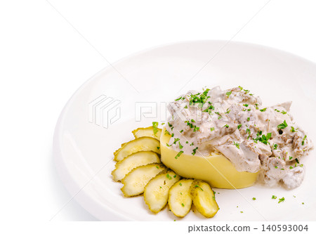 Beef stroganoff with mashed potatoes and sliced pickles Beef stroganoff with mashed potatoes and sliced pickles 140593004