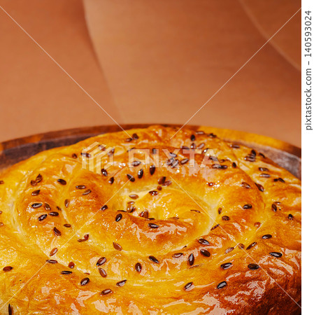 Spiral banitsa pie topped with flax seeds Spiral banitsa pie topped with flax seeds 140593024