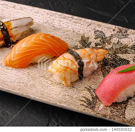 Assorted nigiri sushi set on ceramic plate 140593032