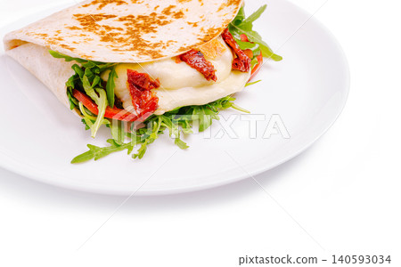 Gourmet tortilla wrap with cheese and sundried tomatoes Gourmet tortilla wrap with cheese and sundried tomatoes 140593034