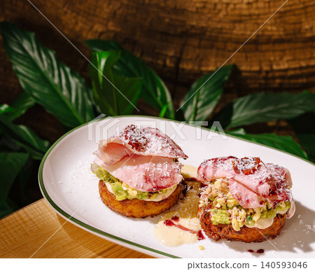 Gourmet potato rosti with ham and avocado 140593046
