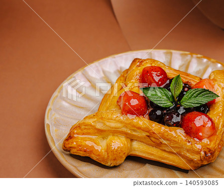 Sweet puff pastry danish with fresh berries Sweet puff pastry danish with fresh berries 140593085