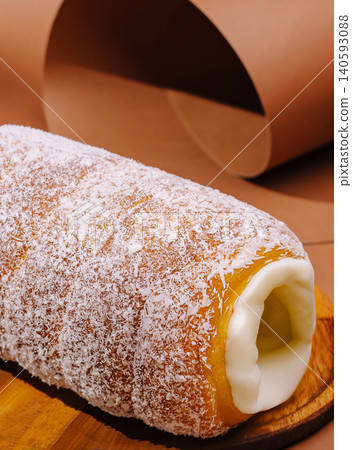 Gourmet chimney cake with coconut and cream Gourmet chimney cake with coconut and cream 140593088