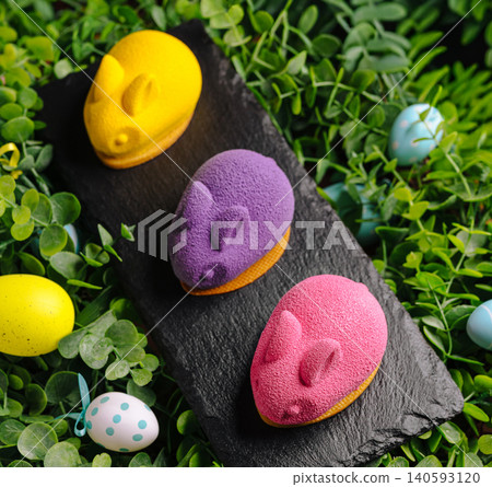 Easter bunny mousse cakes on slate board 140593120