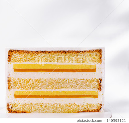 Layered sponge cake with mango passionfruit filling Layered sponge cake with mango passionfruit filling 140593121