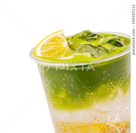 Layered green tea and lemon soda drink with ice and citrus Layered green tea and lemon soda drink with ice and citrus 140593122