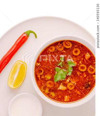 Traditional solyanka meat soup with olives and lemon Traditional solyanka meat soup with olives and lemon 140593130