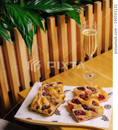 Sweet berry focaccia slices with sparkling wine Sweet berry focaccia slices with sparkling wine 140593132