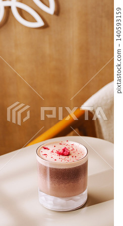 Pink foam coffee drink with dried strawberry Pink foam coffee drink with dried strawberry 140593159