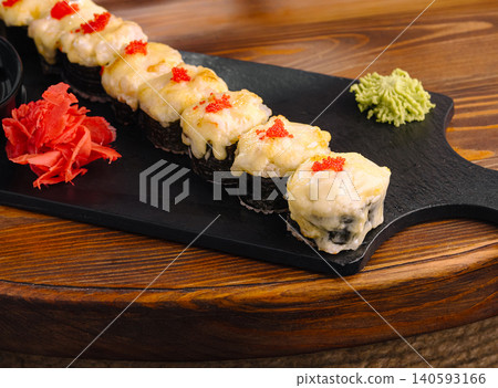 Baked sushi rolls with cheese caviar topping Baked sushi rolls with cheese caviar topping 140593166