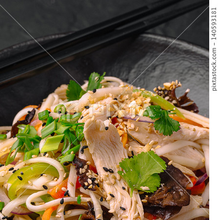 Chicken udon noodles stir fry with sesame Chicken udon noodles stir fry with sesame 140593181