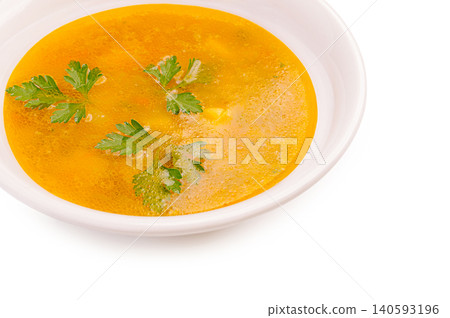 Golden chicken soup broth with fresh parsley Golden chicken soup broth with fresh parsley 140593196