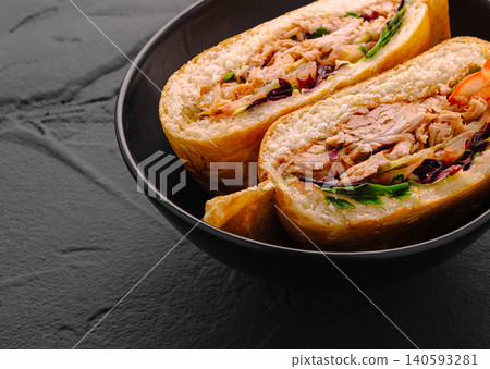 Gourmet pulled pork sandwich cut in half 140593281