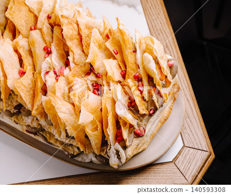 Gourmet layered napoleon cake with pomegranate seeds Gourmet layered napoleon cake with pomegranate seeds 140593308