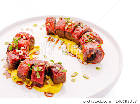 Gourmet meat rolls with bell pepper glazing Gourmet meat rolls with bell pepper glazing 140593318