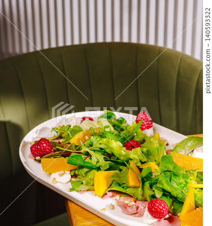 Fresh Salad with Fruits Berries and Prosciutto Fresh Salad with Fruits Berries and Prosciutto 140593322