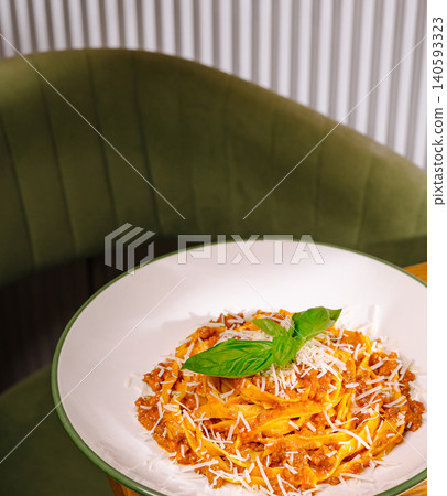 Italian tagliatelle pasta bolognese with grated parmesan 140593323