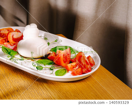 Fresh Burrata Cheese Salad with Ripe Tomatoes Fresh Burrata Cheese Salad with Ripe Tomatoes 140593329