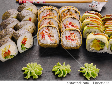 Assorted sushi rolls set with wasabi rosettes Assorted sushi rolls set with wasabi rosettes 140593386