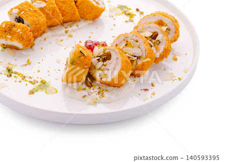 Baked chicken cordon bleu roll with nuts Baked chicken cordon bleu roll with nuts 140593395