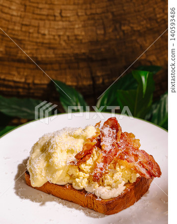 Scrambled Egg Toast With Crispy Bacon Strips Scrambled Egg Toast With Crispy Bacon Strips 140593486