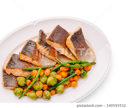 Pan Seared Salmon Fillets With Brussels Sprouts And Carrots Pan Seared Salmon Fillets With Brussels Sprouts And Carrots 140593532