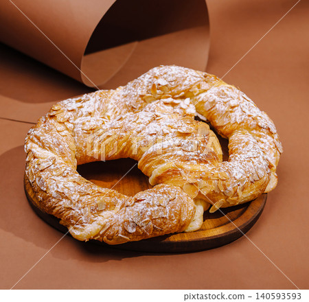 Almond Kringle Puff Pastry On Brown Background Almond Kringle Puff Pastry On Brown Background 140593593