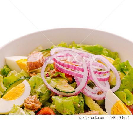 Fresh salad with tuna, eggs, and vegetables served in a bowl 140593695