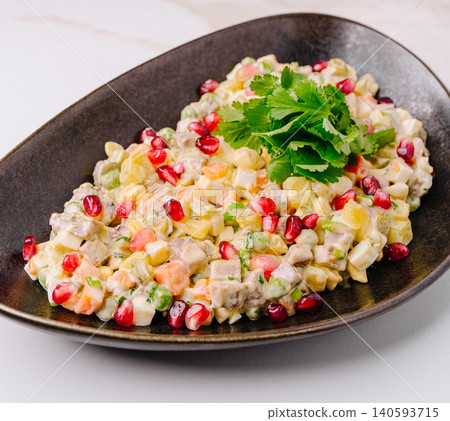 Traditional Olivier Salad With Fresh Pomegranate Seeds Traditional Olivier Salad With Fresh Pomegranate Seeds 140593715