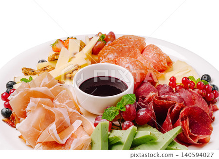 Charcuterie board with meats, cheeses, and fruits for a gathering Charcuterie board with meats, cheeses, and fruits for a gathering 140594027