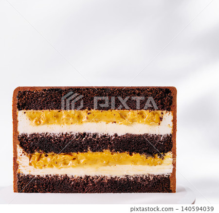 Piece Of Layered Chocolate Cake With Caramel Piece Of Layered Chocolate Cake With Caramel 140594039