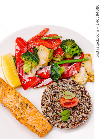 Grilled salmon and quinoa with mixed vegetables on a white plate Grilled salmon and quinoa with mixed vegetables on a white plate 140594080