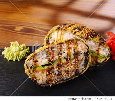 Fried Sushi Burger Halves On Black Slate Board Fried Sushi Burger Halves On Black Slate Board 140594095