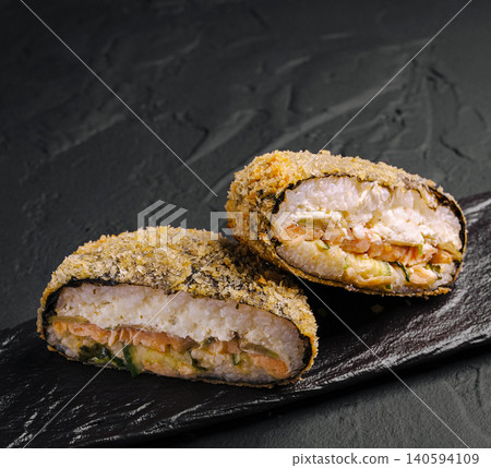 Fried Sushi Burger Halves On Black Stone Slate Fried Sushi Burger Halves On Black Stone Slate 140594109