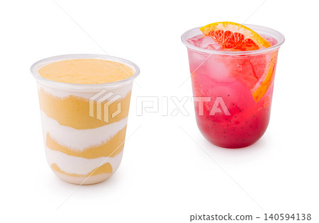 Two cups of drinks on white background ready for serving at a summer event Two cups of drinks on white background ready for serving at a summer event 140594138