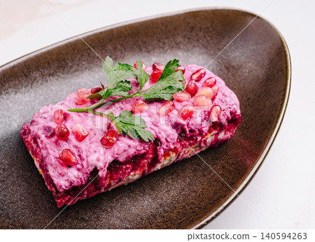 A beetroot salad placed on a brown plate A beetroot salad placed on a brown plate 140594263