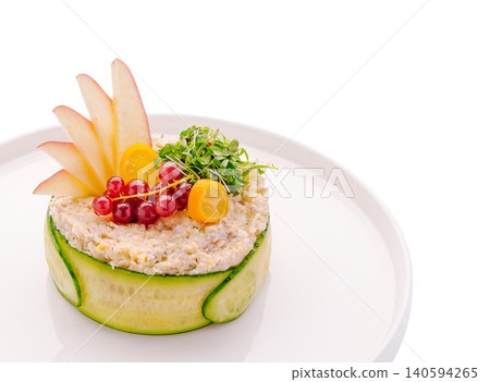 Creative food presentation on a white plate with fresh ingredients 140594265