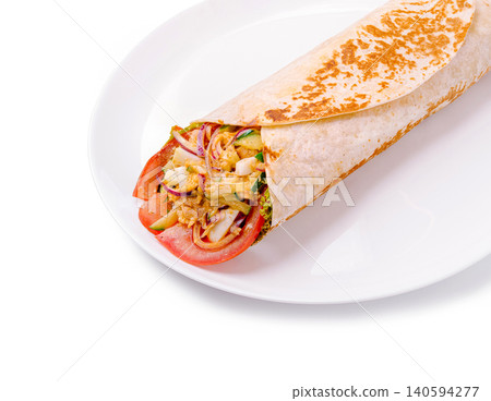 Fresh wrap with vegetables and protein served on a white plate during lunchtime 140594277