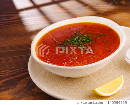 Traditional Hot Red Beet Soup Served With Lemon Traditional Hot Red Beet Soup Served With Lemon 140594339