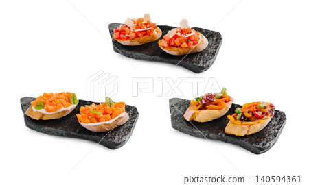Three different types of bruschetta served on dark stone plates Three different types of bruschetta served on dark stone plates 140594361