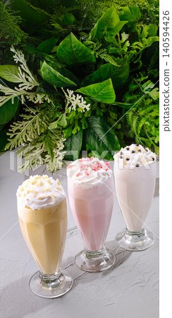 Three Assorted Delicious Milkshakes With Fresh Whipped Cream 140594426