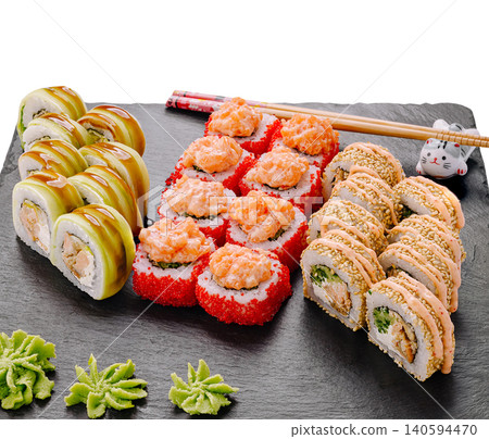 Enjoying sushi at a restaurant in the evening with friends 140594470