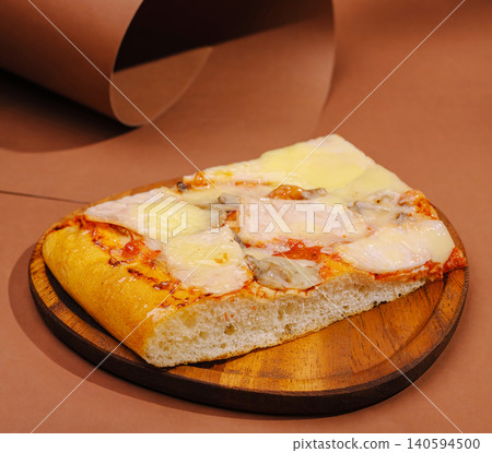 Slice of pizza with cheese on wooden plate, simple background and focus Slice of pizza with cheese on wooden plate, simple background and focus 140594500